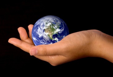 A woman holds a globe of the Earth. A woman holds a globe of the Earth.
