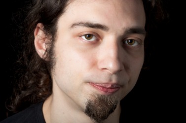 A young man wearing a goatee. A young man wearing a goatee.
