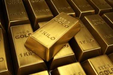 A stack of gold bars. A stack of gold bars.