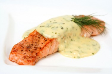 A salmon fillet with bearnaise sauce. A salmon fillet with bearnaise sauce.