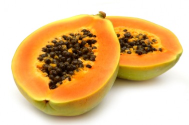 A papaya cut in half. A papaya cut in half.