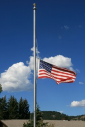 The United States flag at half-mast. The United States flag at half-mast.