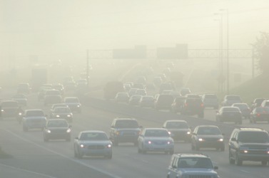 Smog created haze over a freeway. Smog created haze over a freeway.