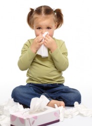 A little girl with a head cold. A little girl with a head cold.