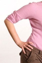 A woman with her hand on her hip. A woman with her hand on her hip.