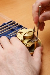 A horologist at work. A horologist at work.