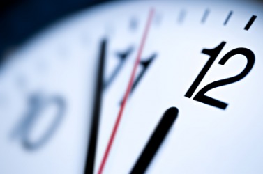 Hands of a clock approaching the hour. Hands of a clock approaching the hour.