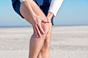 It would appear that this mans knee is hurt. It would appear that this mans knee is hurt.