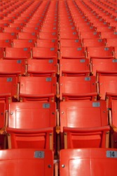 Identical seats in a stadium. Identical seats in a stadium.