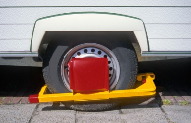 An impediment to this cars' movement is this wheel clamp. An impediment to this cars' movement is this wheel clamp.