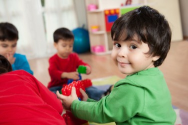 A child playing indoors. A child playing indoors.