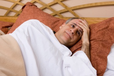 A man suffering from insomnia. A man suffering from insomnia.