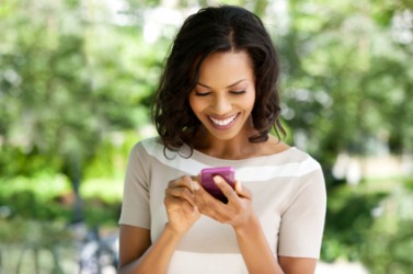 A woman sending an instant message. A woman sending an instant message.