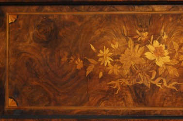 A table with an intarsia design. A table with an intarsia design.