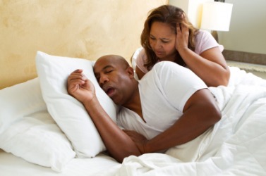 A woman finds her husbands snoring an irritation. A woman finds her husbands snoring an irritation.