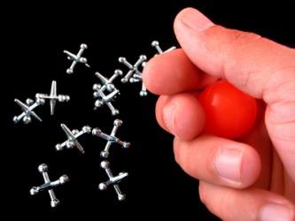 The childs game of jacks. The childs game of jacks.