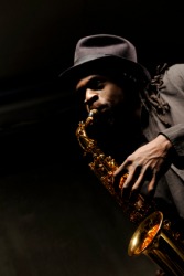 A jazz musician playing a saxophone. A jazz musician playing a saxophone.