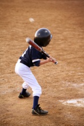 A young ballplayer in a baseball game. A young ballplayer in a baseball game.