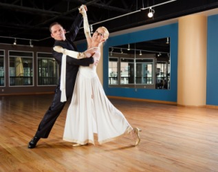 A couple ballroom dancing. A couple ballroom dancing.