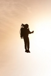 A man wearing a jetpack. A man wearing a jetpack.