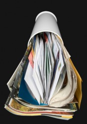 A box filled with junk mail. A box filled with junk mail.