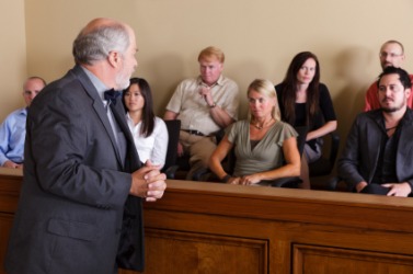 An attorney looks towards a juror. An attorney looks towards a juror.