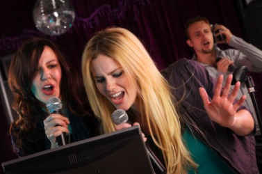 Karaoke singers. Karaoke singers.