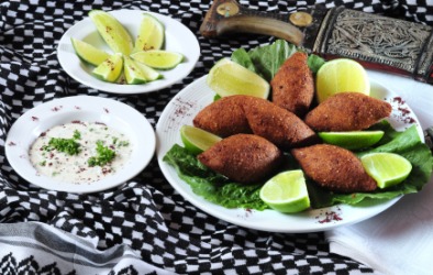 A Lebanese meal featuring kibbe. A Lebanese meal featuring kibbe.