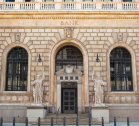 The front of a classic style bank building. The front of a classic style bank building.