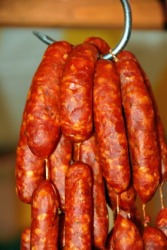 Knackwurst hanging from a hook. Knackwurst hanging from a hook.