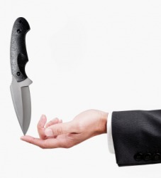 A blade being balanced by knifepoint. A blade being balanced by knifepoint.