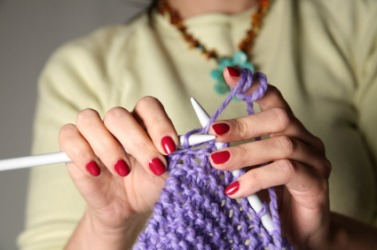 This woman likes to knit. This woman likes to knit.