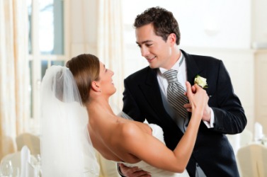 A groom dances with his bride. A groom dances with his bride.