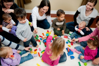 These children and adults are engaged in a social activity. These children and adults are engaged in a social activity.