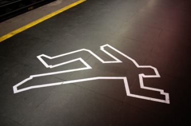 The taped outline of a body at a crime scene. The taped outline of a body at a crime scene.
