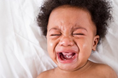 An upset baby wails. An upset baby wails.