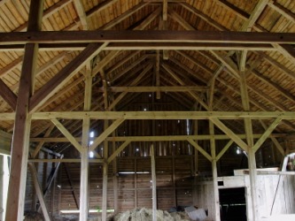 Wooden braces support the roof of this barn. Wooden braces support the roof of this barn.