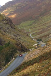 A road winds through the hills. A road winds through the hills.