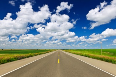 A level road in the prairie. A level road in the prairie.