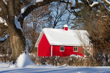 A red barn in the snow. A red barn in the snow.