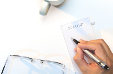 A person about to make a laundry list for the day. A person about to make a laundry list for the day.