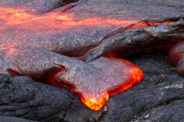 Magma flowing from a volcano. Magma flowing from a volcano.