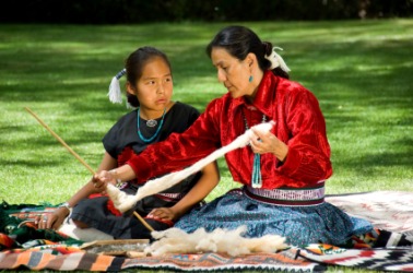 A Navajo woman and her granddaughter. A Navajo woman and her granddaughter.