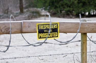 A barrier in the form of a barbwire fence. A barrier in the form of a barbwire fence.