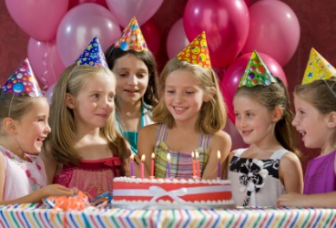 A little girl celebrates the occasion of her birthday. A little girl celebrates the occasion of her birthday.