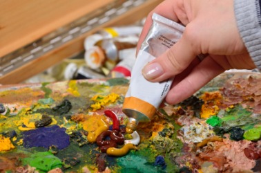 An artist using oil paint. An artist using oil paint.