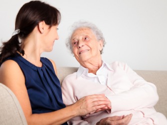 An old woman with her caregiver. An old woman with her caregiver.
