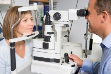 A woman being examined by an optometrist. A woman being examined by an optometrist.
