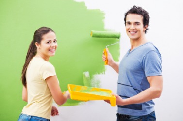A couple paint their walls green. A couple paint their walls green.