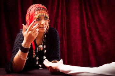 This woman is a palmist. This woman is a palmist.